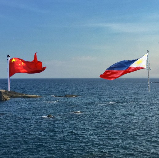 Tensions Flare as China and Philippines Display Competing Flags on Disputed South China Sea Sandbank