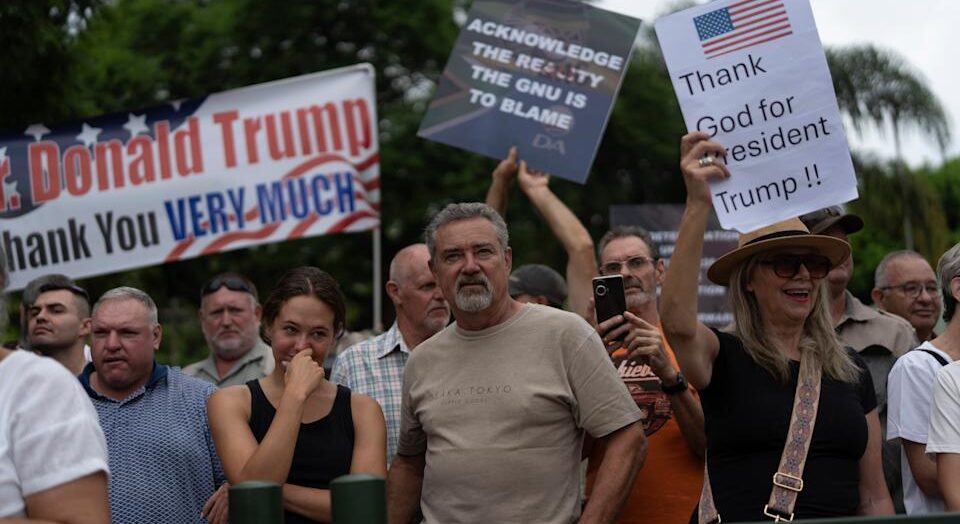 White South African Refugees Arrive in U.S. Under Trump Policy, Stirring Controversy