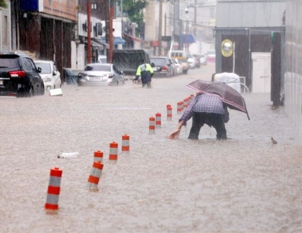 Two people have died and more than 1,000 residents have been evacuated in South Korea after torrential rain battered parts of the country on Thursday, according to the Ministry of the Interior and Safety