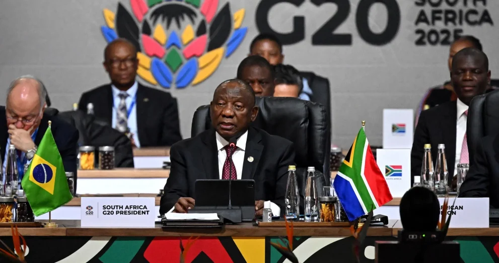 The Group of 20 summit in South Africa adopted a joint declaration on climate action, debt relief, and broader global challenges, despite the absence of the United States and differing views among several members. The document was completed after negotiations that proceeded without U.S. involvement, marking a departure from the G20’s traditional reliance on full consensus. South African officials said the text could not be renegotiated, noting that it reflected months of work and that participating members had reached what they considered sufficient agreement.